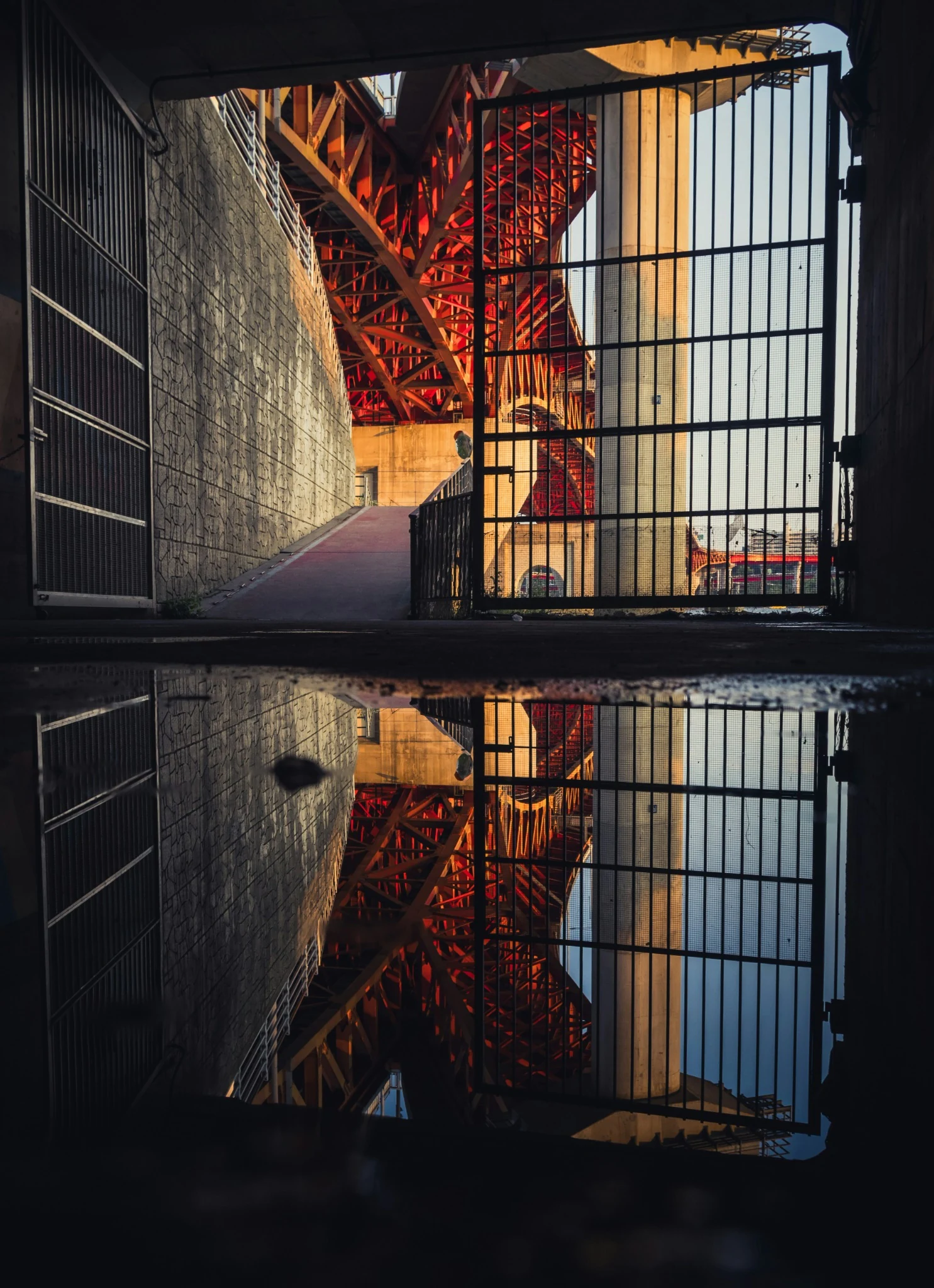 Structure under a red bridge